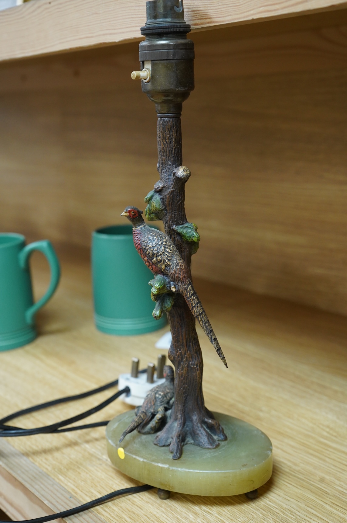 In the manner of Franz Xaver Bergmann (1861-1936), an Austrian cold painted bronze table lamp in the form a tree with pheasants, on green onyx oval base, unmarked, 34cm high including fitting